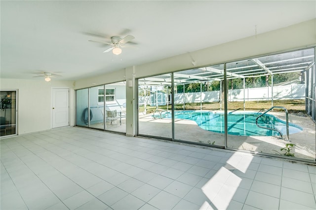 view of swimming pool featuring ceiling fan