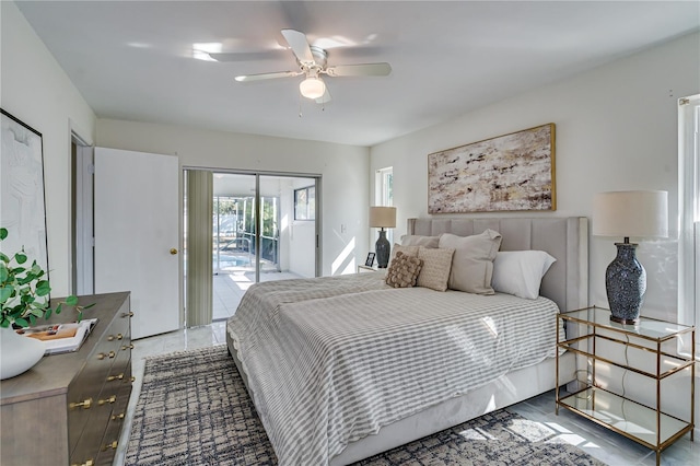 bedroom with hardwood / wood-style floors, access to exterior, and ceiling fan