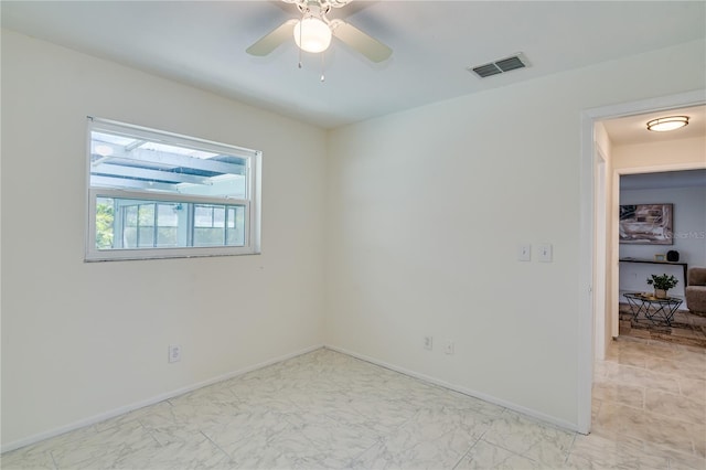 unfurnished room with ceiling fan