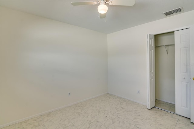 unfurnished bedroom featuring a closet and ceiling fan