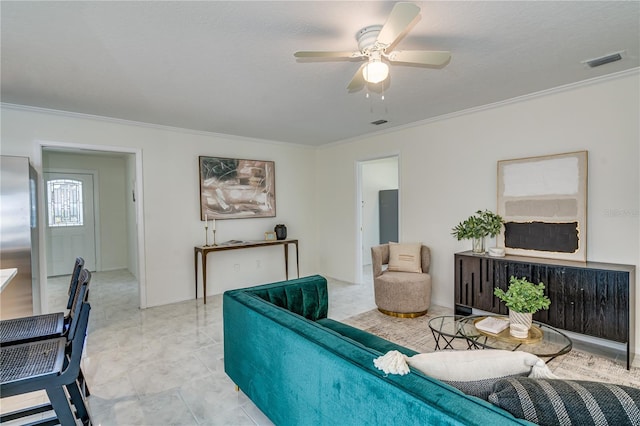 tiled living room with ornamental molding, a textured ceiling, and ceiling fan