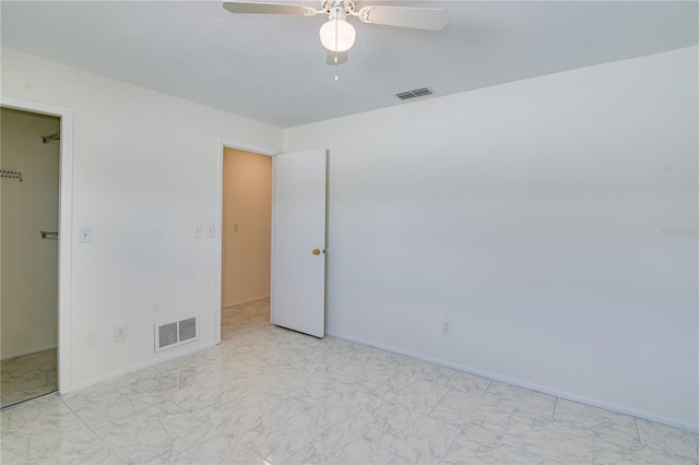 unfurnished room with ceiling fan