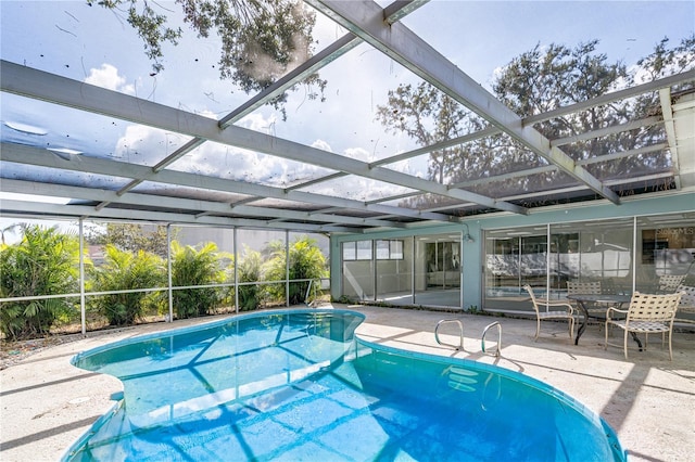 view of pool featuring a patio area and a lanai