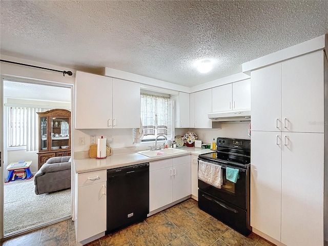 kitchen featuring white cabinetry, black appliances, sink, and a textured ceiling