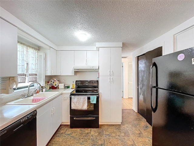 kitchen with white cabinetry, a textured ceiling, black appliances, and sink