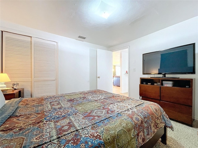 bedroom with a closet and carpet floors