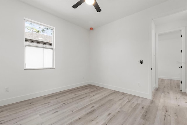 spare room with light hardwood / wood-style floors and ceiling fan