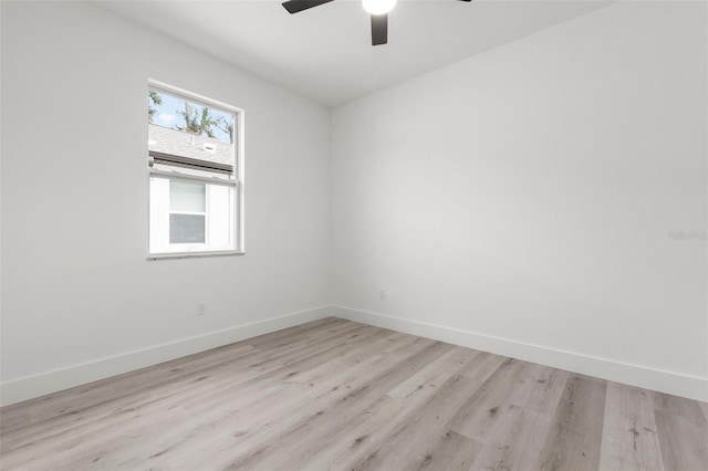 empty room featuring ceiling fan and light wood-type flooring