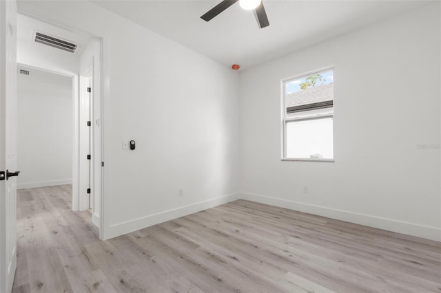 empty room featuring light hardwood / wood-style flooring and ceiling fan