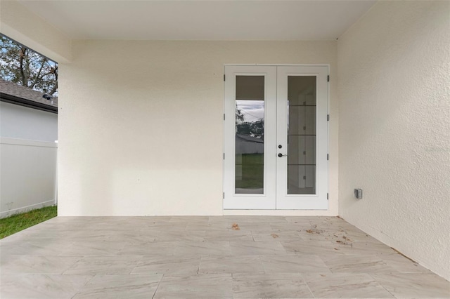 doorway to property with a patio area and french doors