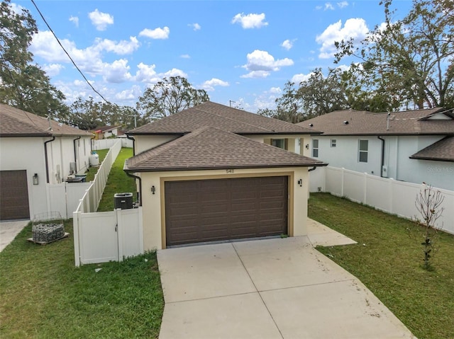 garage with a lawn