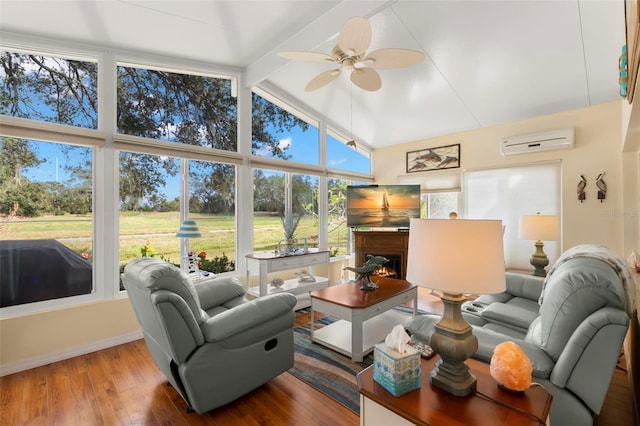 living room featuring wood-type flooring, ceiling fan, beamed ceiling, a wall unit AC, and high vaulted ceiling