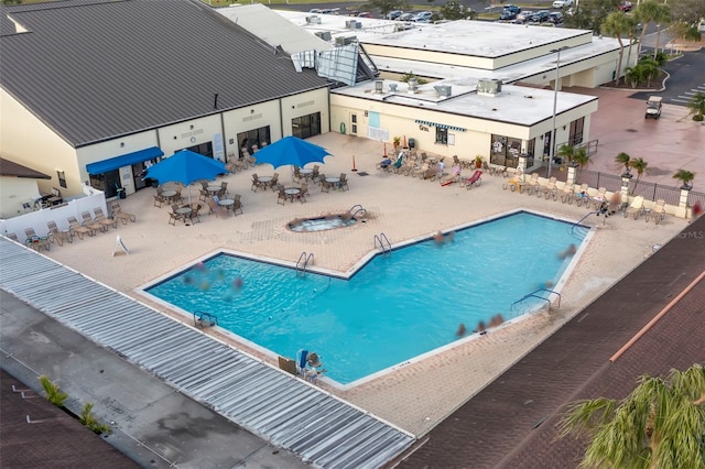 view of pool featuring a patio