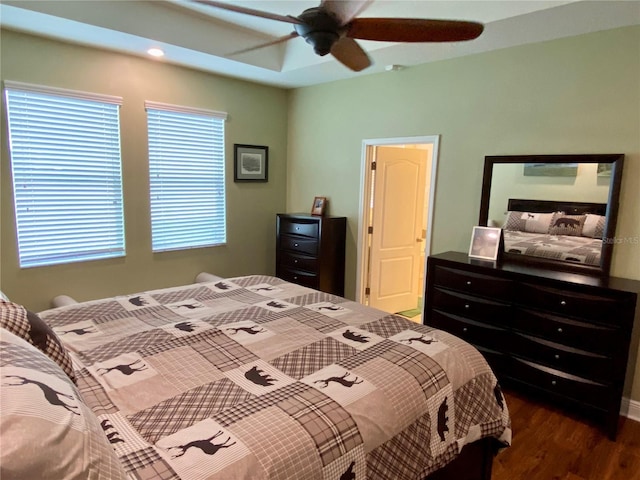 bedroom featuring ceiling fan and dark hardwood / wood-style floors