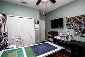 interior space featuring ceiling fan and a closet