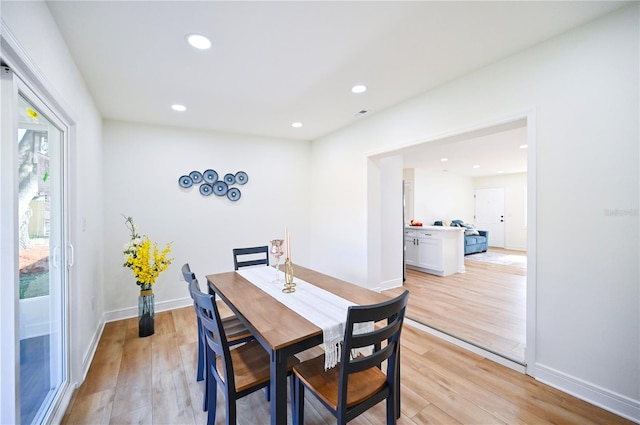 dining space with light wood-type flooring