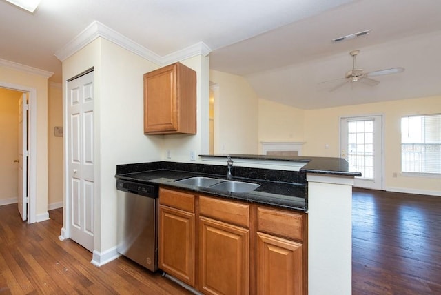 kitchen with dark wood-type flooring, ornamental molding, sink, and stainless steel dishwasher