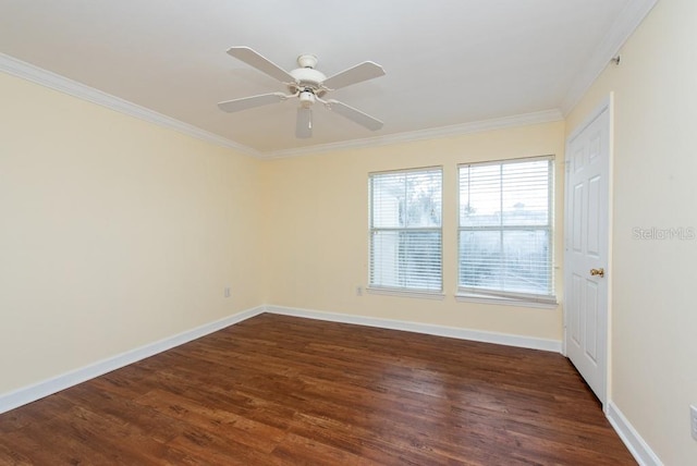 spare room featuring ornamental molding, dark hardwood / wood-style floors, and ceiling fan