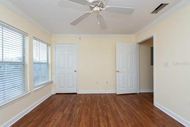 unfurnished bedroom with crown molding, dark hardwood / wood-style floors, and ceiling fan