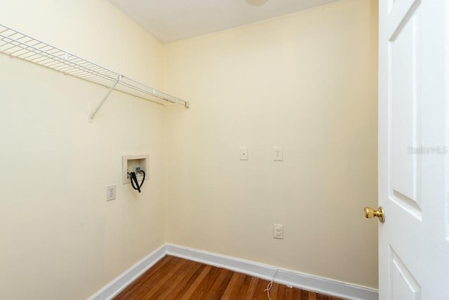 laundry room with dark wood-type flooring and hookup for a washing machine