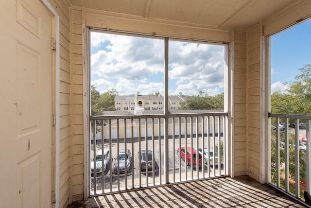 unfurnished sunroom featuring plenty of natural light