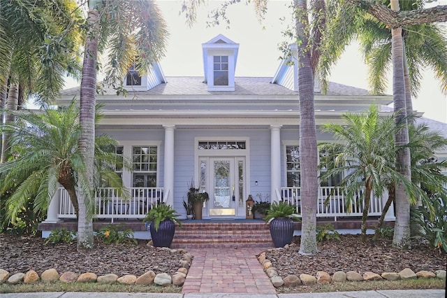 view of exterior entry featuring a porch