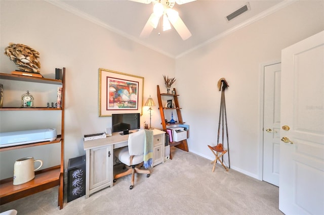 office space with light colored carpet, ceiling fan, and ornamental molding