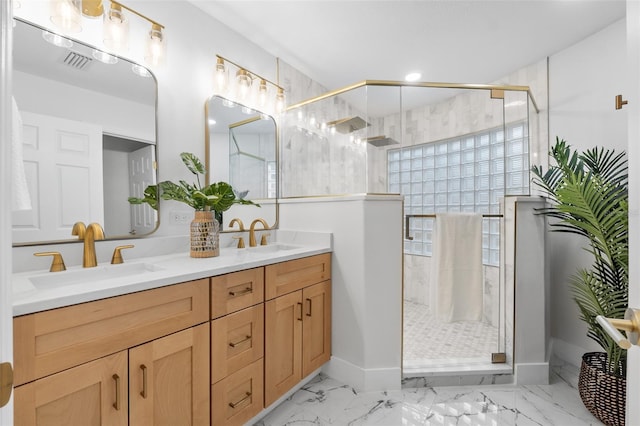 bathroom featuring vanity and an enclosed shower