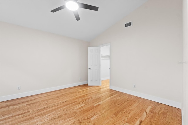 spare room featuring ceiling fan, high vaulted ceiling, and light wood-type flooring