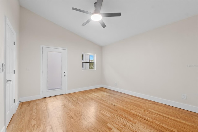 unfurnished room featuring ceiling fan, light hardwood / wood-style flooring, and vaulted ceiling