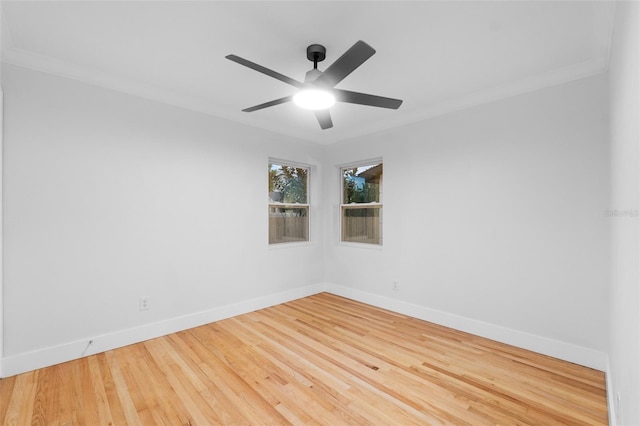 unfurnished room with ceiling fan, wood-type flooring, and ornamental molding