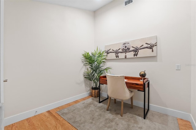 office with hardwood / wood-style floors