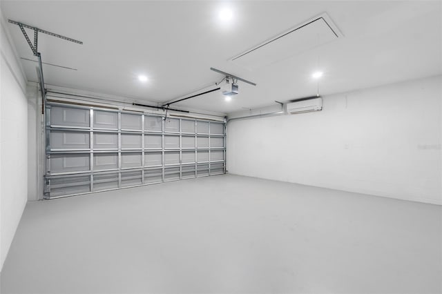 garage with a wall mounted AC and a garage door opener