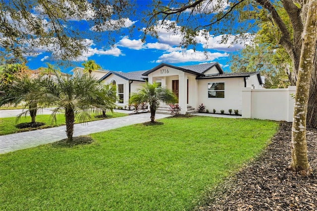 ranch-style home with a front yard