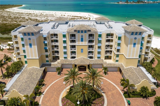 bird's eye view featuring a water view and a view of the beach