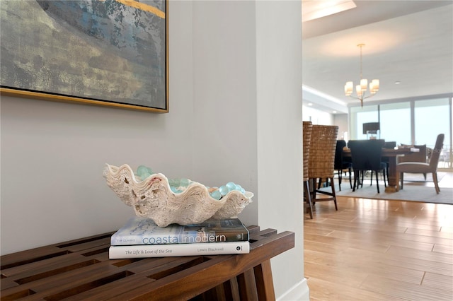 interior space featuring a notable chandelier and hardwood / wood-style flooring