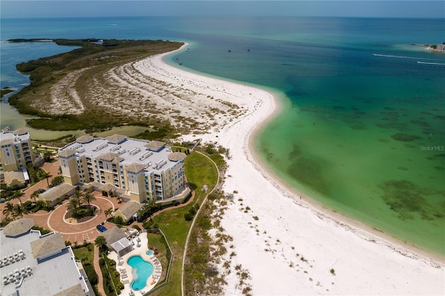 drone / aerial view with a water view and a beach view