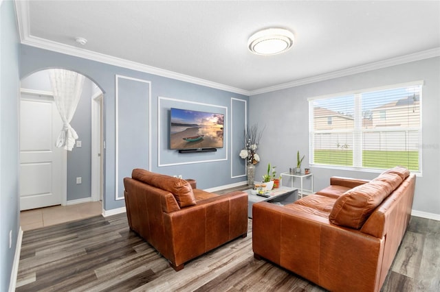 living room featuring crown molding and hardwood / wood-style floors