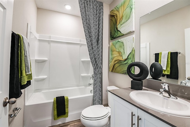 full bathroom with vanity, shower / bath combination with curtain, and toilet