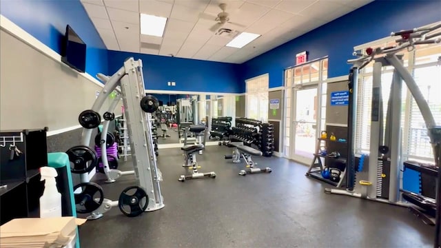 workout area with a paneled ceiling