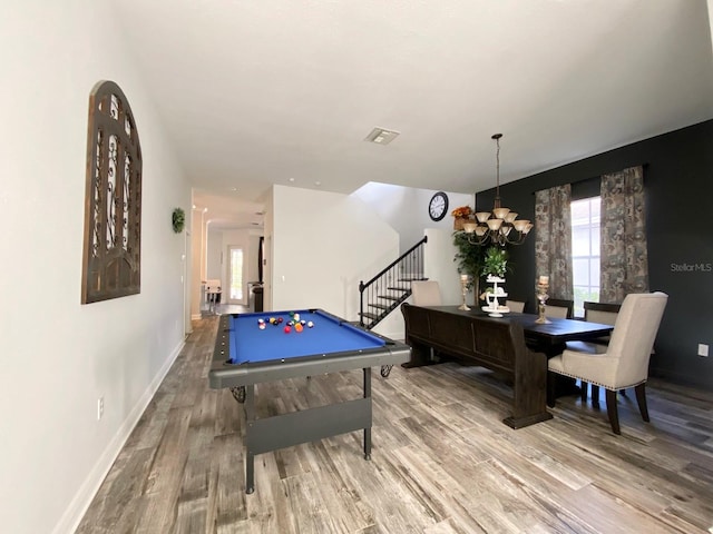 playroom with light hardwood / wood-style flooring, billiards, and an inviting chandelier