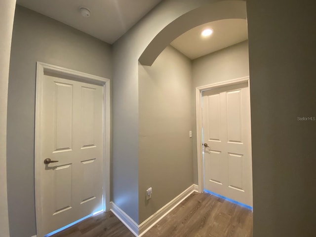 hall with dark wood-type flooring