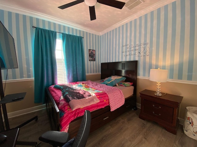 bedroom featuring ceiling fan, wood-type flooring, and ornamental molding