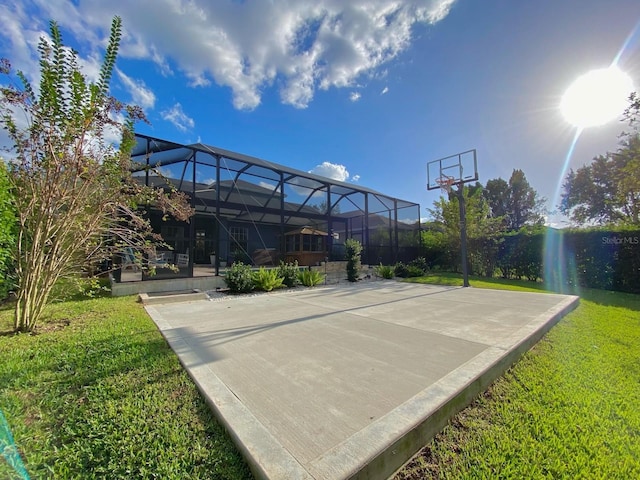 view of basketball court featuring a lawn