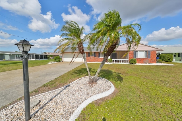 single story home featuring covered porch, a garage, and a front lawn