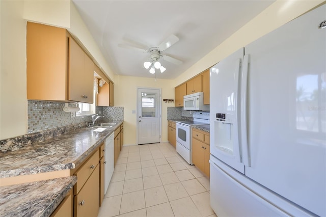 kitchen featuring ceiling fan, sink, tasteful backsplash, white appliances, and light tile patterned floors