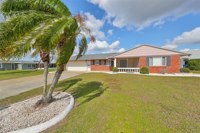 ranch-style home with covered porch, a garage, and a front lawn