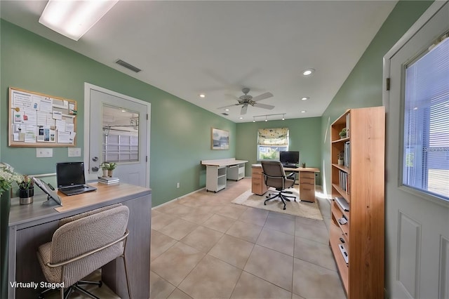 office featuring light tile patterned floors and ceiling fan