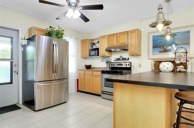 kitchen with light brown cabinets, kitchen peninsula, pendant lighting, light tile patterned floors, and appliances with stainless steel finishes