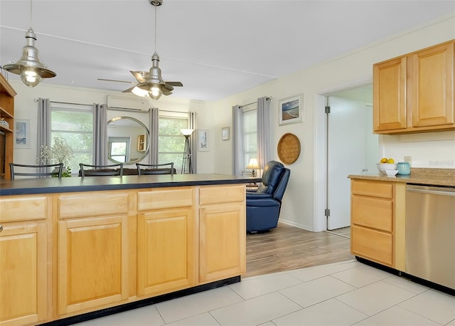 kitchen with light hardwood / wood-style floors, light brown cabinetry, dishwasher, and a wall unit AC